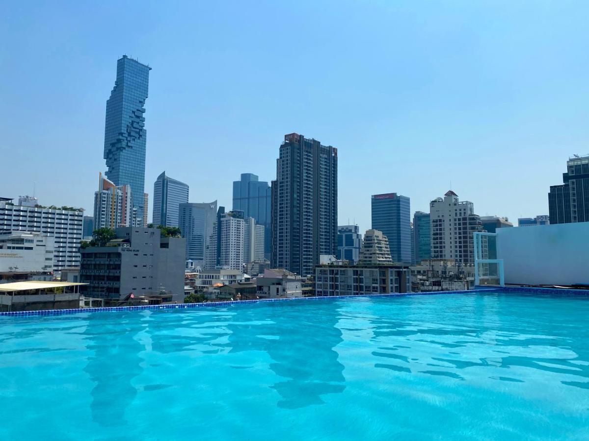 Sapphire Hotel Silom Bangkok Exterior photo View of the city from the rooftop pool